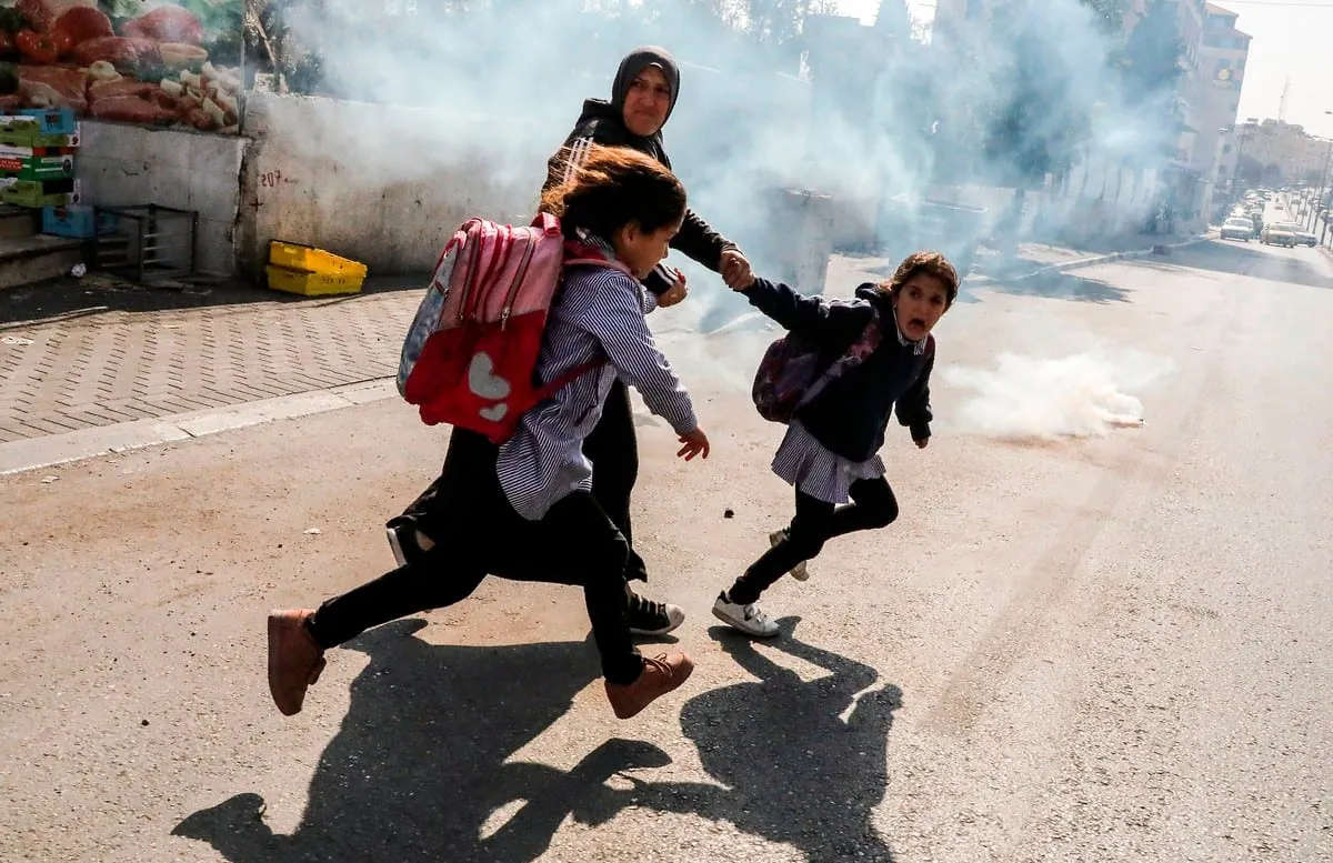 Israeli forces fire teargas at Palestinian children, several suffer suffocation 